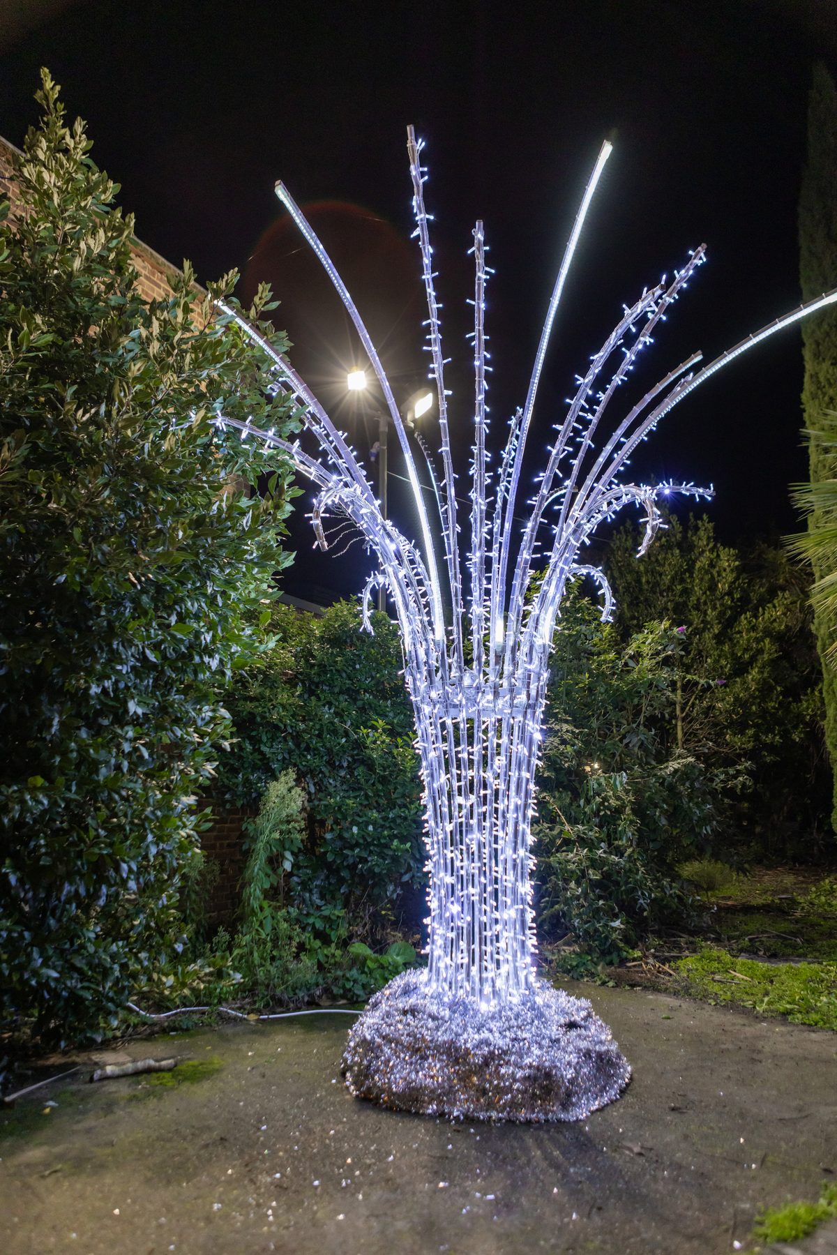 A glowing light installation bursting over the town centre