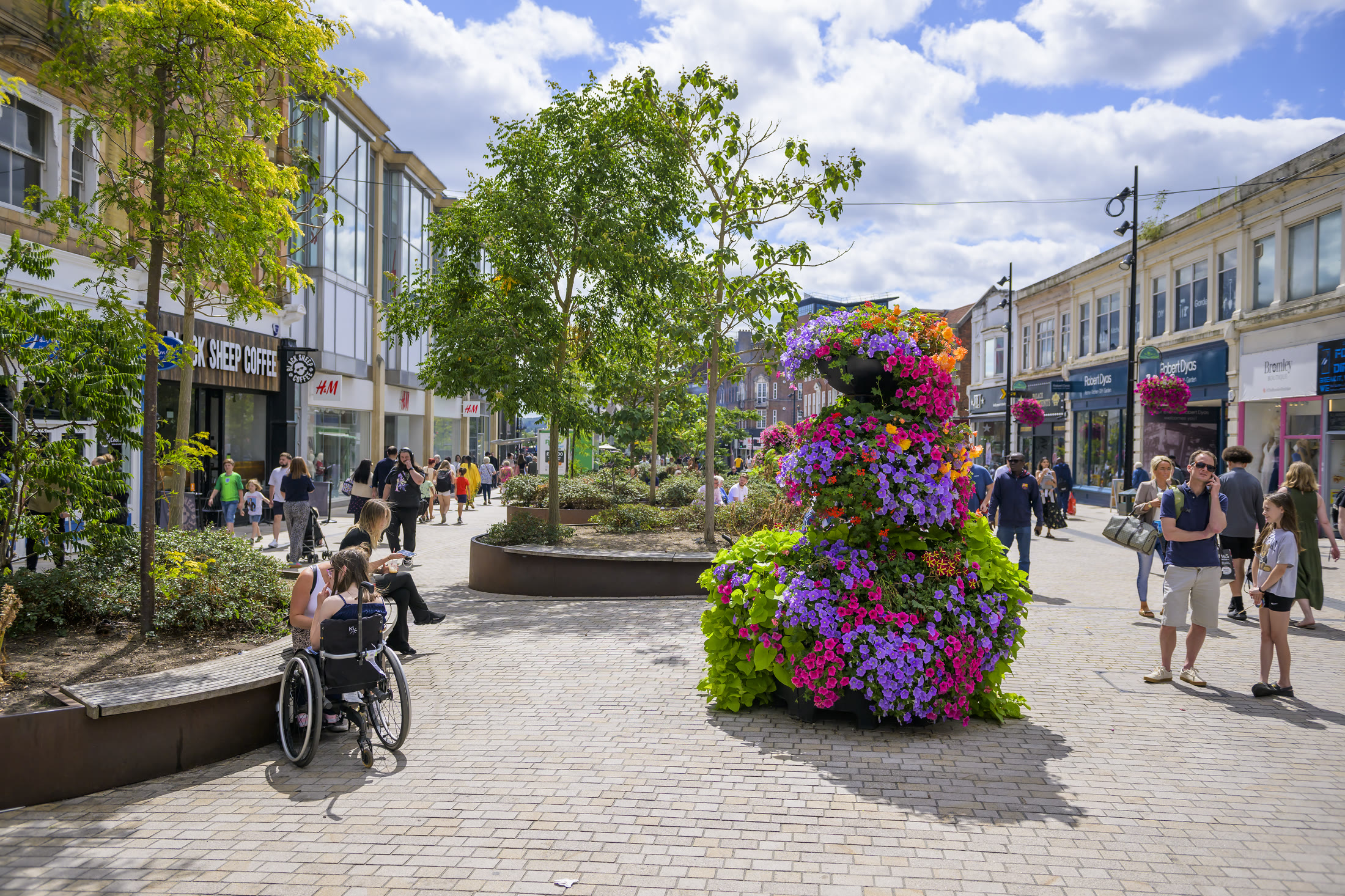 Summer on Bromley High Street – floral planters, shoppers and shopfronts